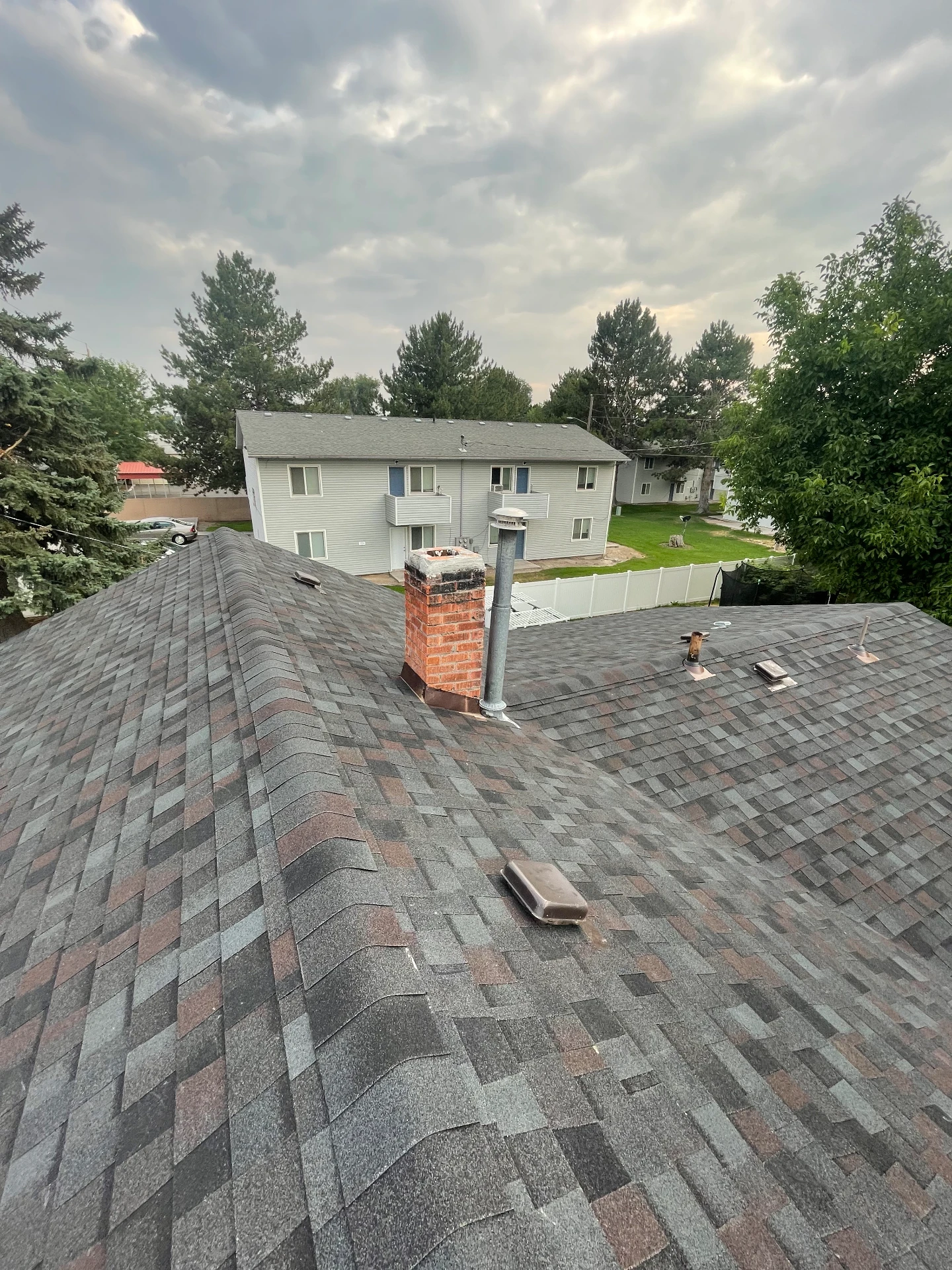 Roof replacement with new chimney flashing and roof vents